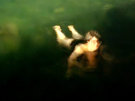 Experimental ICM photography — a swimmer's form softened into brushstroke-like motion blur